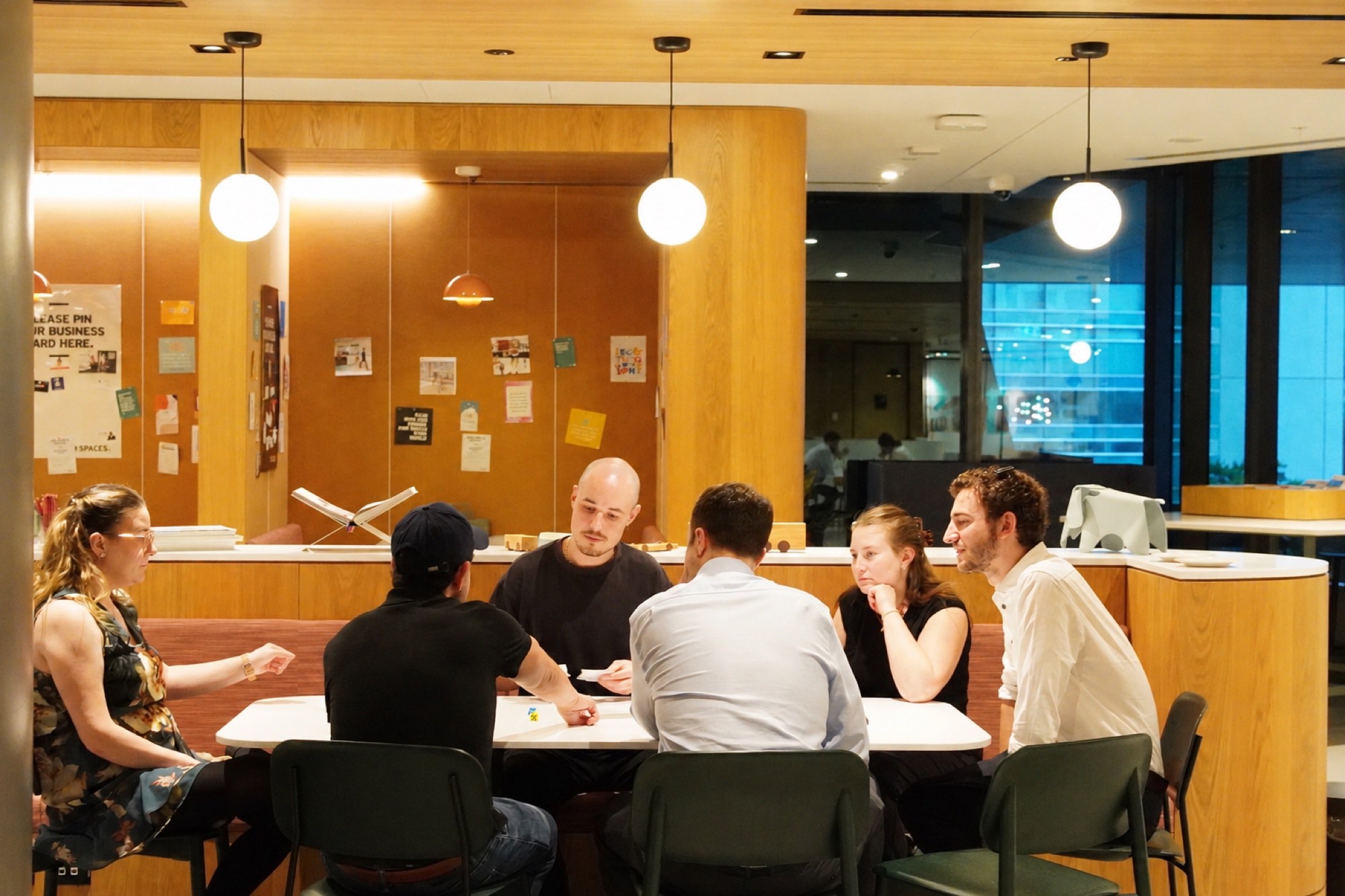 OFO Collective in a working session — operators around a table, mid-conversation.